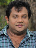 Hareesh Perumanna in Padachone Ingal Katholee as Kerala Kumaran