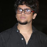 K to compose music for Onbadhula Guru
