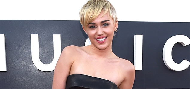 Miley Cyrus goes topless again for women empowerment campaign