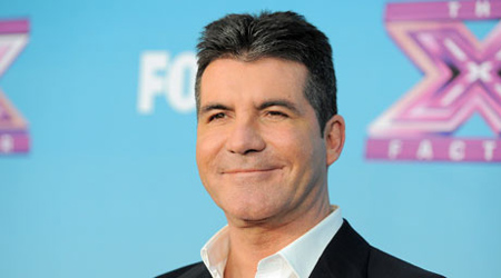 Cowell gets police warning