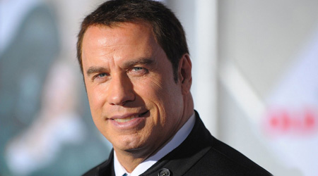 Travolta beating himself for error at Oscars
