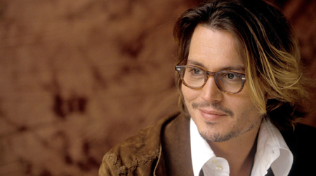 Johnny Depp escorts Amber Heard to award event