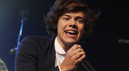Harry Styles ditches quiff for matted down hairdo