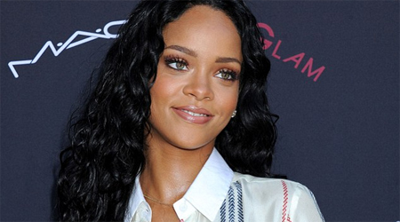 Rihanna ups oomph factor in lingerie inspired costume
