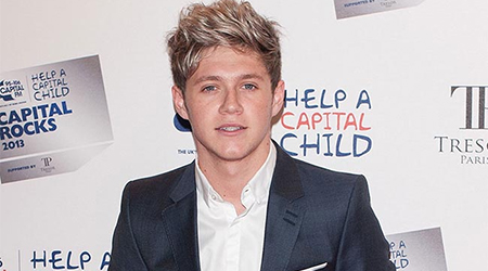 Niall Horan begs fans to stop throwing objects on stage