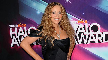 Carey to spend 115,000 pounds on dogs holiday