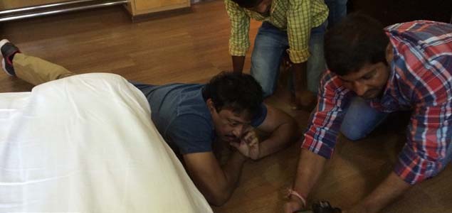 Ram Gopal Varma at the feet of Manchu Lakshmi