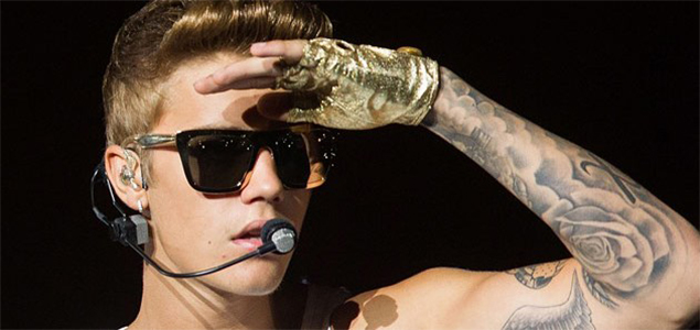 Justin Bieber gets name of his new album tattooed across his abs