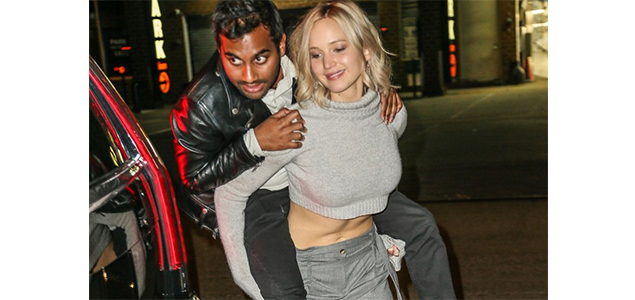Jennifer Lawrence shows off her strength by giving Aziz Ansari a piggyback ride