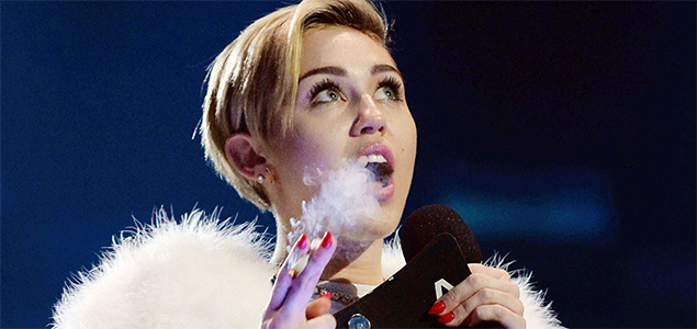 Miley Cyrus takes things to the next level, smokes a joint on stage during performance