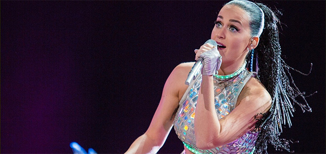 Katy Perry gets groped and kissed by a fan on stage during her performance in Rio
