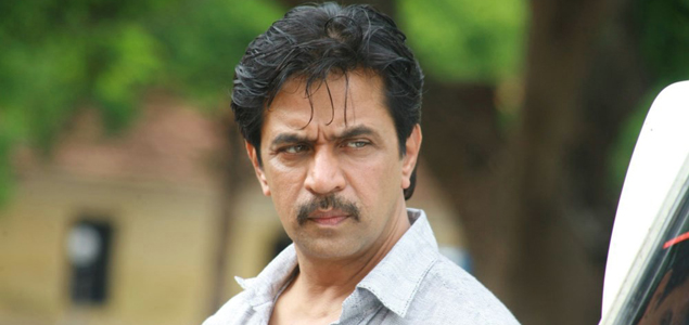 Action King Arjun as an intelligent cop, in Nibunan